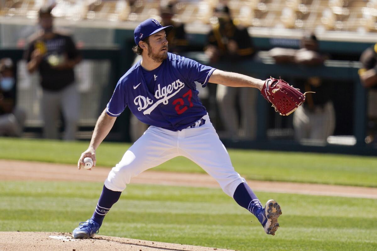 Dodgers pitcher Trevor Bauer throws with one eye open against the San Diego Padres on March 6.