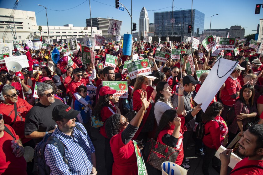 Thousands of teachers, students and supporters stage a protest Saturday in downtown Los Angeles as union members prepare to strike.