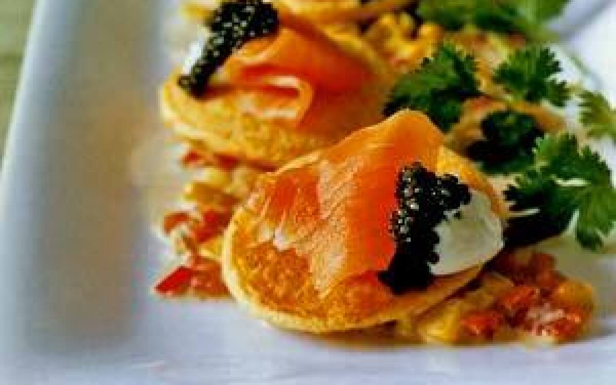 Red pepper pancakes with corn and caviar