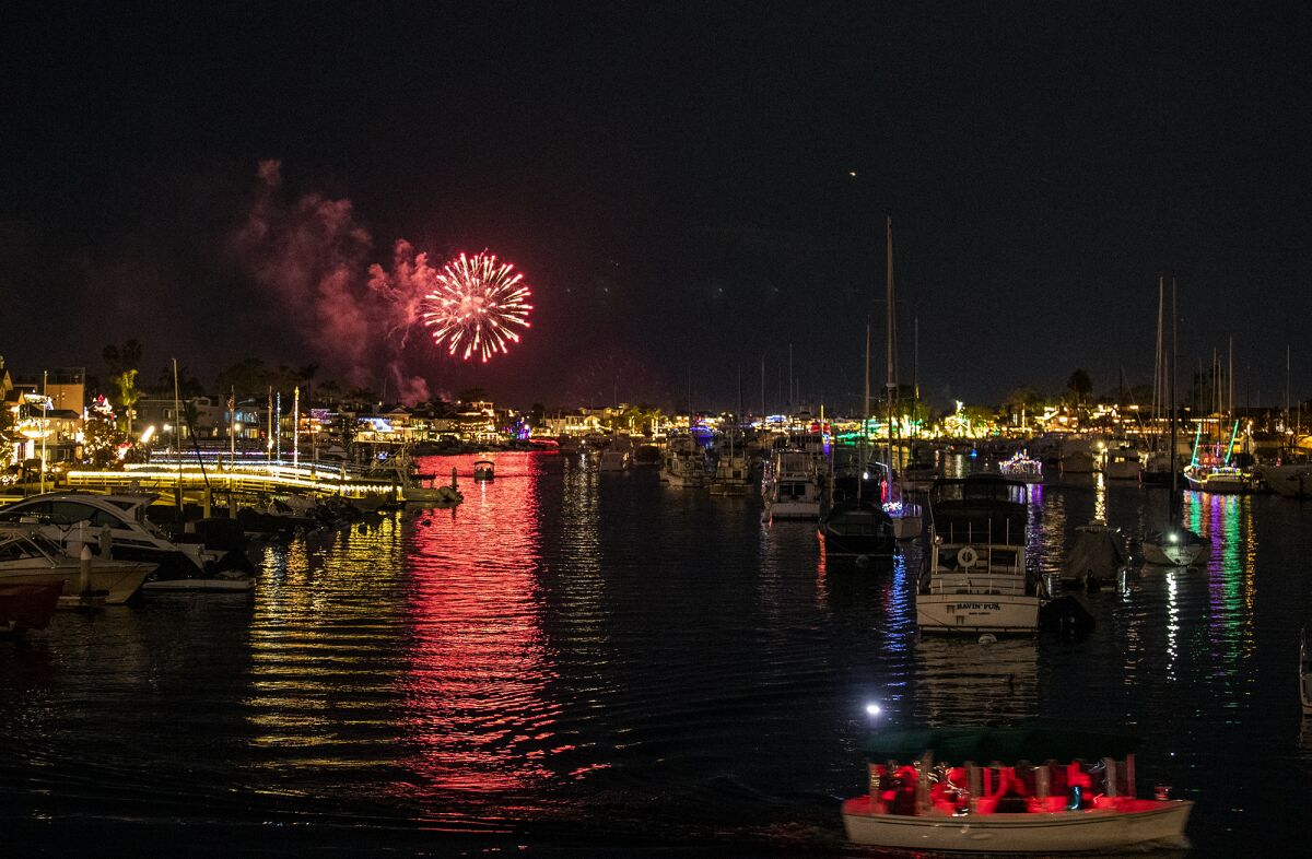 Fireworks launch the beginning of the 113th annual Newport  Christmas Boat Parade.