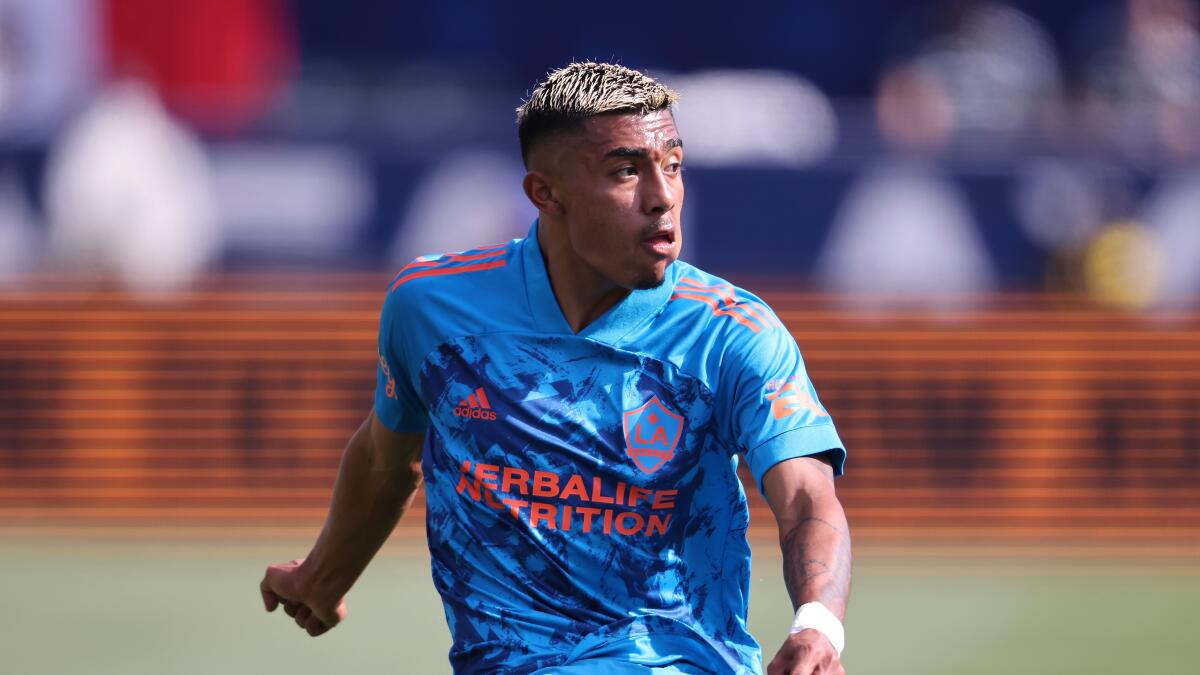 Los Angeles Galaxy defender Julian Araujo sends a pass deep into San Jose Earthquakes territory 