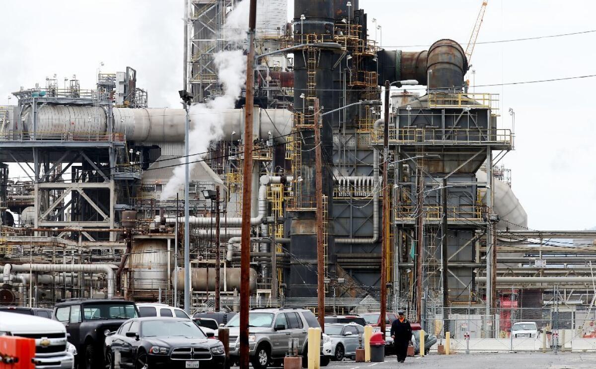 Oil refineries, such as this one in Torrance, could face stricter rules on emissions. (Luis Sinco / Los Angeles Times)