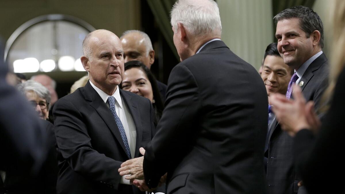 Gov. Jerry Brown arrives for his State of the State speech on Thursday