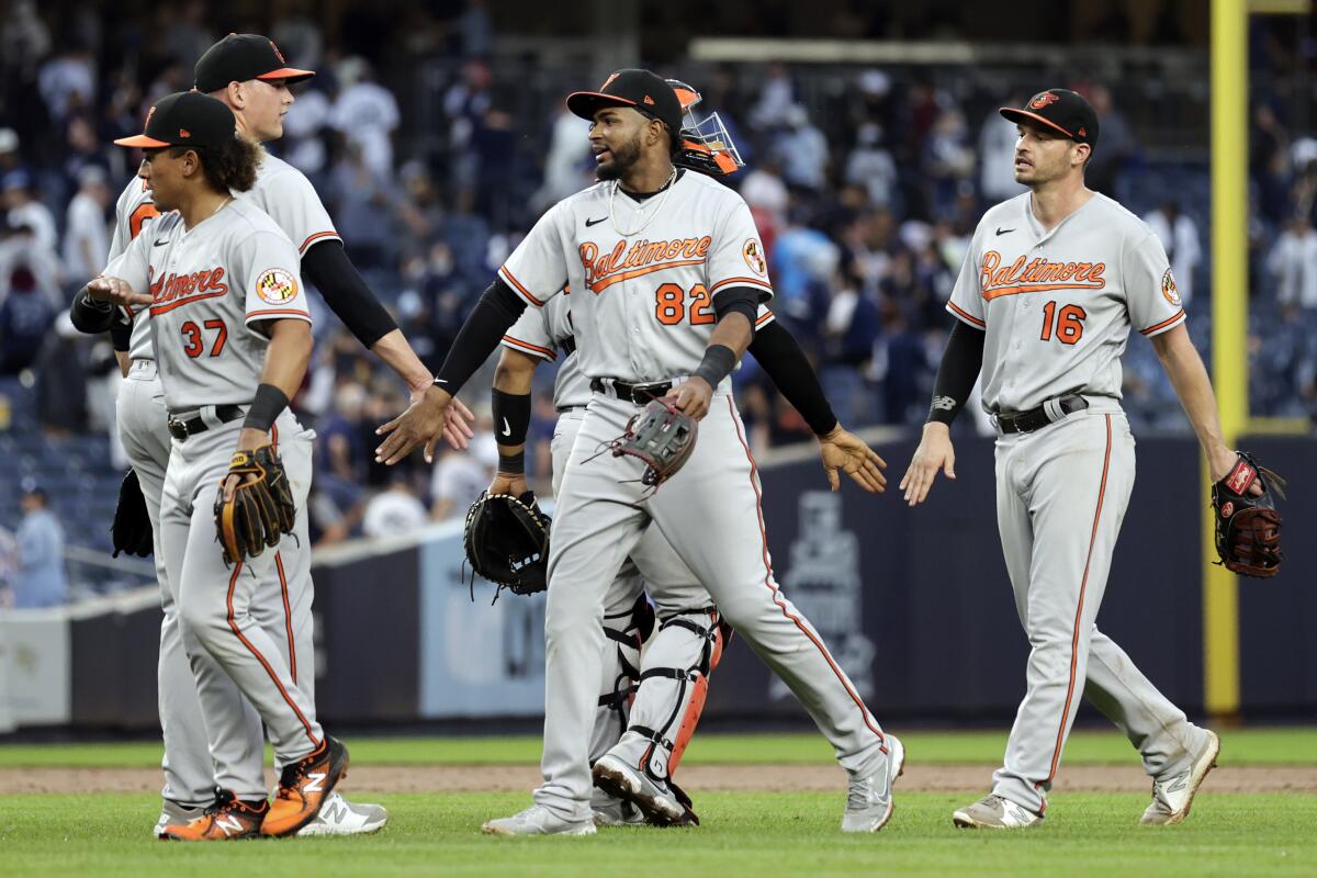 Baltimore Orioles third baseman Kelvin Gutierrez (82) celebrates with teammates after they defeated the New York Yankees in a baseball game on Sunday, Sept. 5, 2021, in New York. (AP Photo/Adam Hunger)