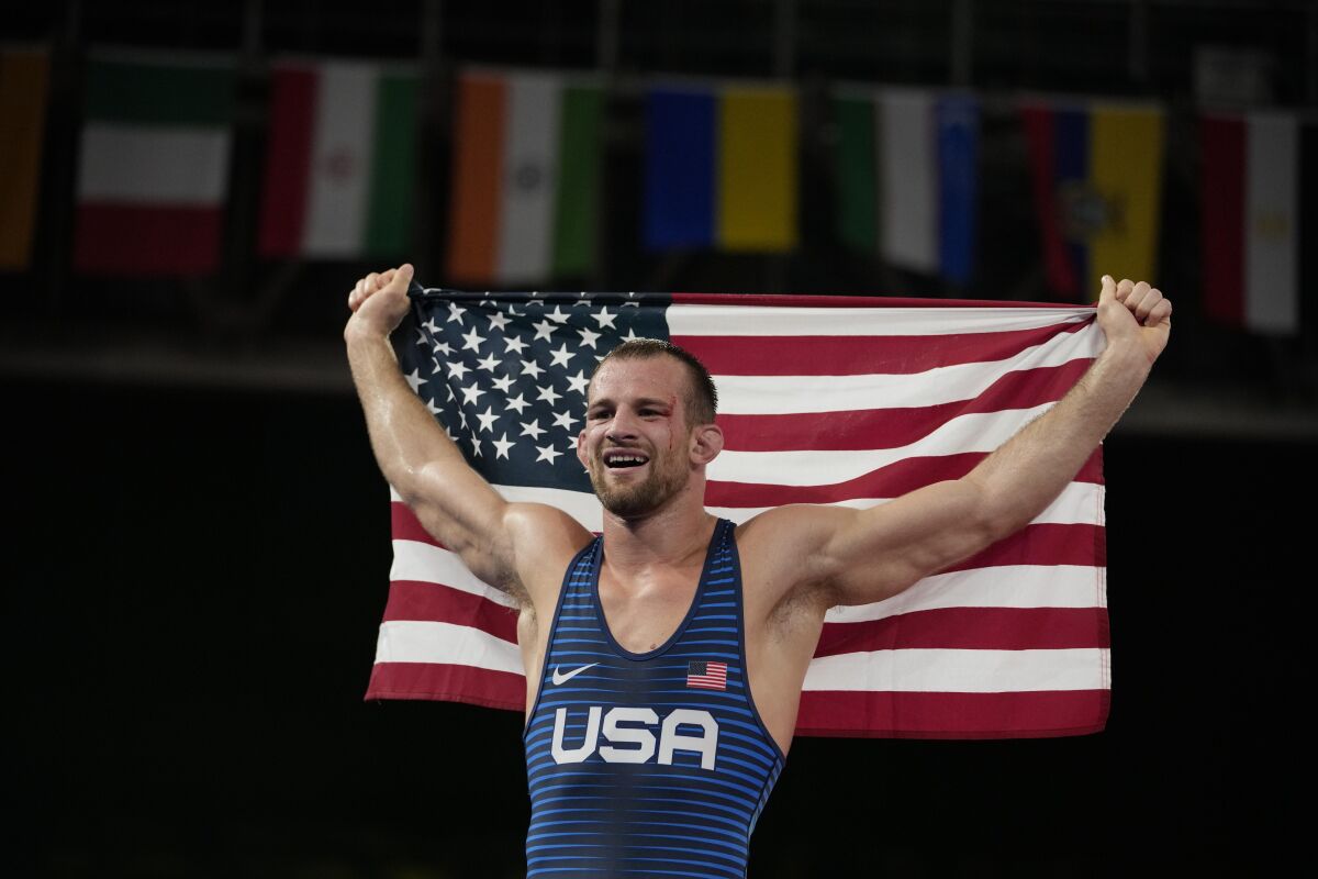 United States' David Morris Taylor III celebrates holding the US flag after winning the gold medal in the men's 86kg Freestyle wrestling event at the 2020 Summer Olympics, Thursday, Aug. 5, 2021, in Tokyo, Japan. (AP Photo/Aaron Favila)