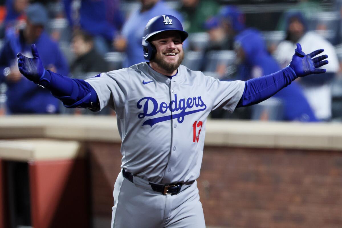 Max Muncy celebrates after hitting a solo home run in the ninth inning of a 8-0 win over the Mets.