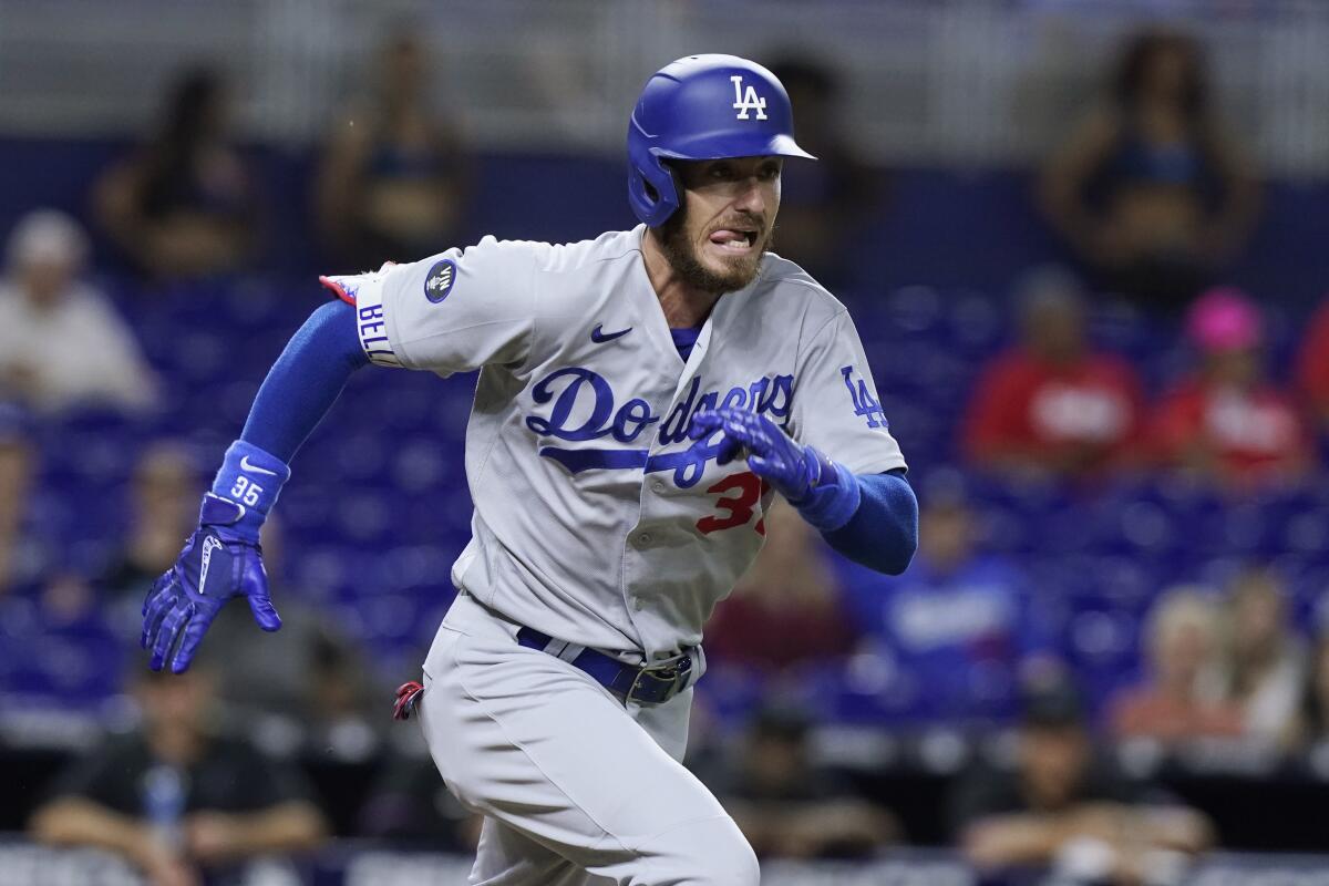 Dodgers center fielder Cody Bellinger runs to first base during a win over the Miami Marlins on Friday.