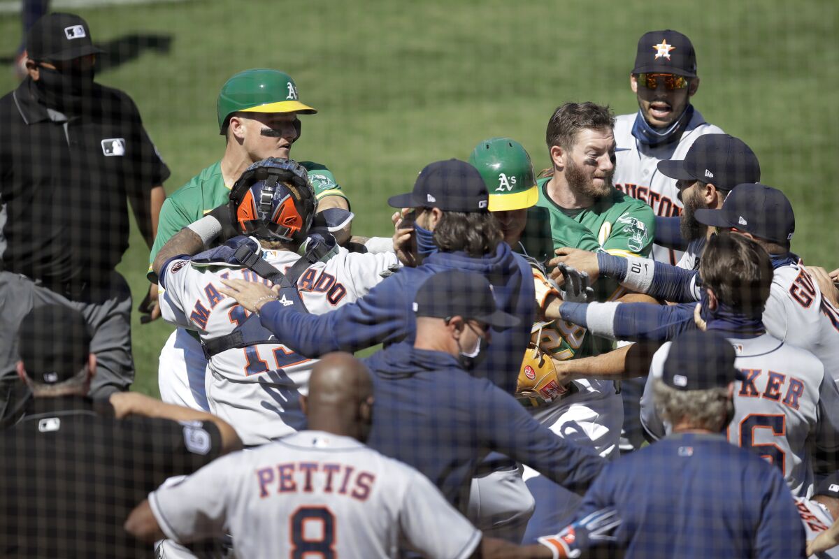 Oakland Athletics and Houston Astros players get into an on-field scuffle during Sunday's game.