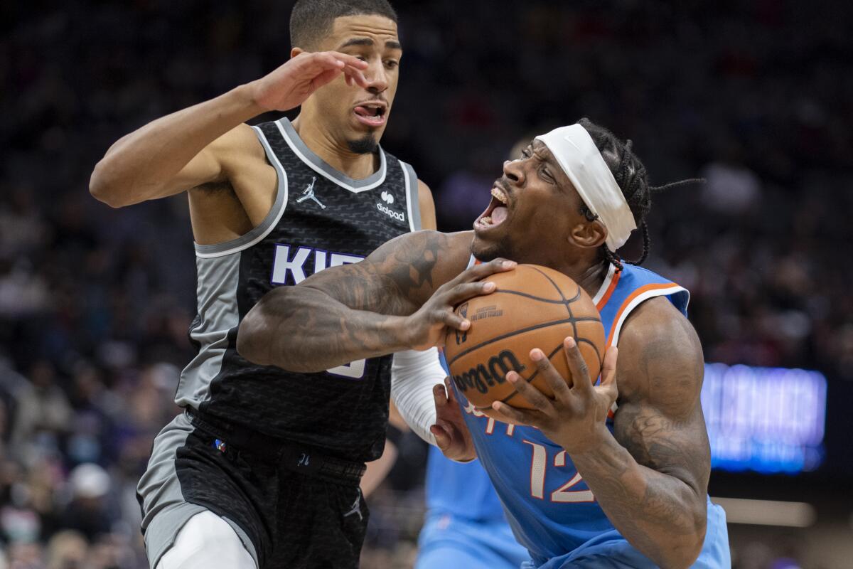 Clippers guard Eric Bledsoe is fouled by Sacramento Kings guard Tyrese Haliburton.