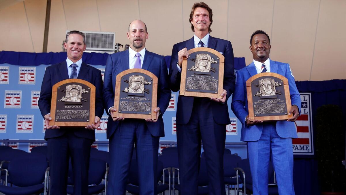 Newly-inducted National Baseball Hall of Famers Craig Biggio, John Smoltz, Randy Johnson and Pedro Martinez after an induction ceremony in Cooperstown, N.Y. on July 26, 2015.