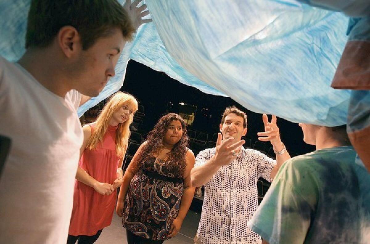Co-writer and original-company performer Greg Pierotti, gesturing at center, works with Fullerton College students, from left, Jon Wailin, Anna Dorey, Ashley Bravo and Daniel Hunt.