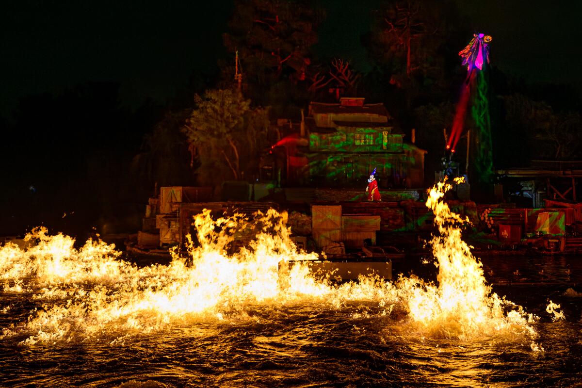 Disneyland's Rivers of America is engulfed in fire.