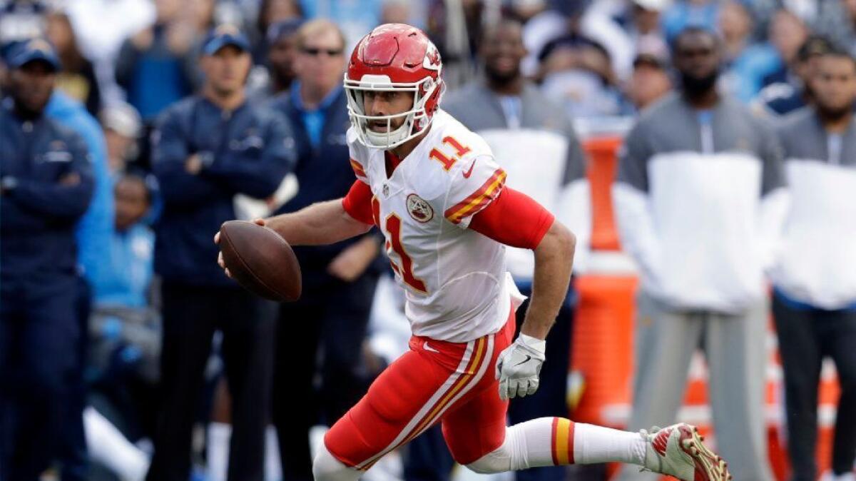 Chiefs quarterback Alex Smith runs with the ball during a game against the Chargers in San Diego on Jan. 1.