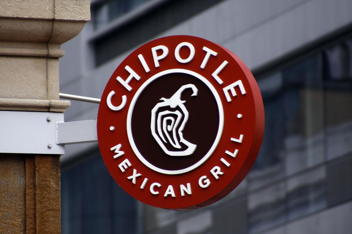 FILE - A Chipotle sign hangs outside the chain restaurant in Pittsburgh on Feb. 8, 2016. In June 2022, employees of the Augusta, Maine, Chipotle filed a petition with the National Labor Relations Board asking to hold a union election at the store. The NLRB had scheduled a hearing Tuesday, July 19, 2022, on Chipotle’s objections to the union election. But early Tuesday, Chipotle announced it was permanently closing the store. (AP Photo/Keith Srakocic, File)