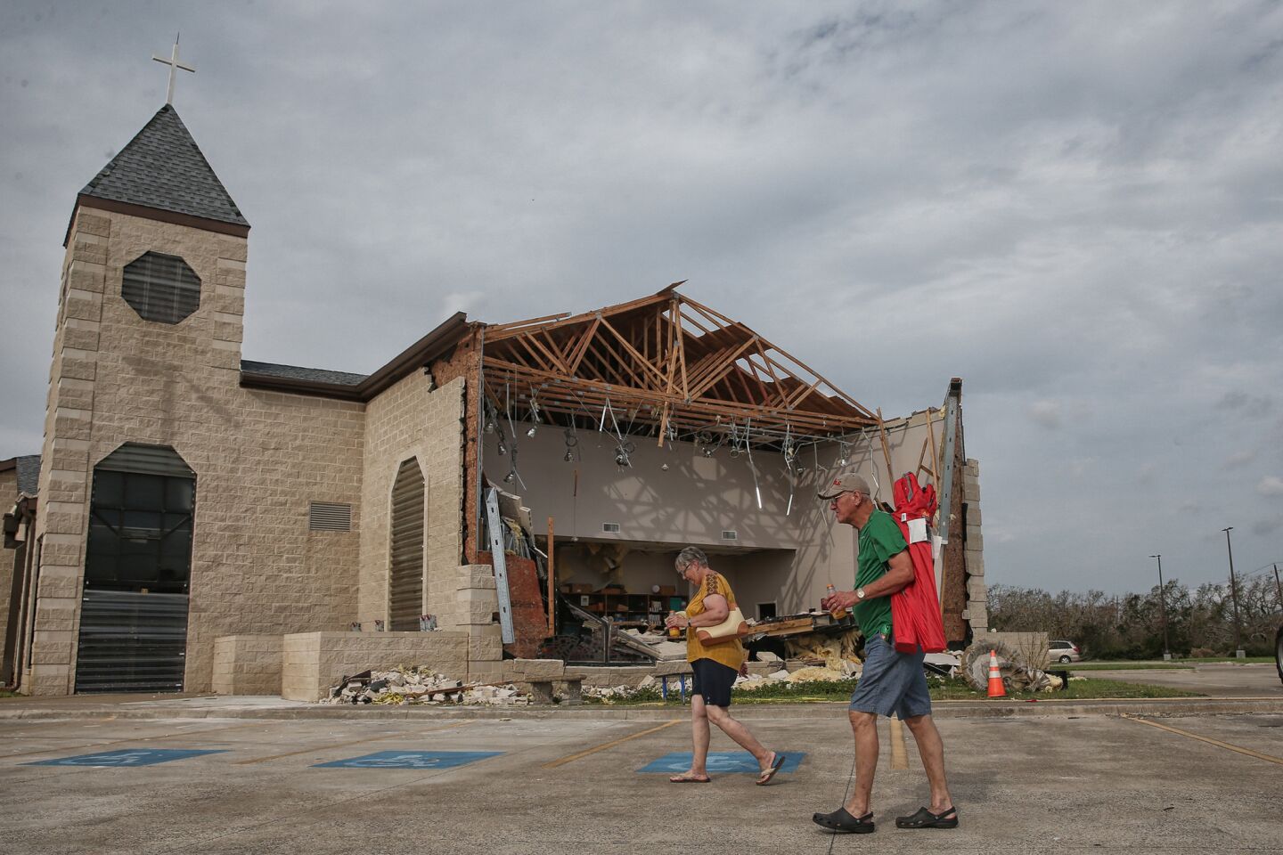 Hurricane Harvey severely damaged the First Baptist Church in Rockport, Texas. Worshipers on Sunday brought their own chairs to take part in an outdoor service.