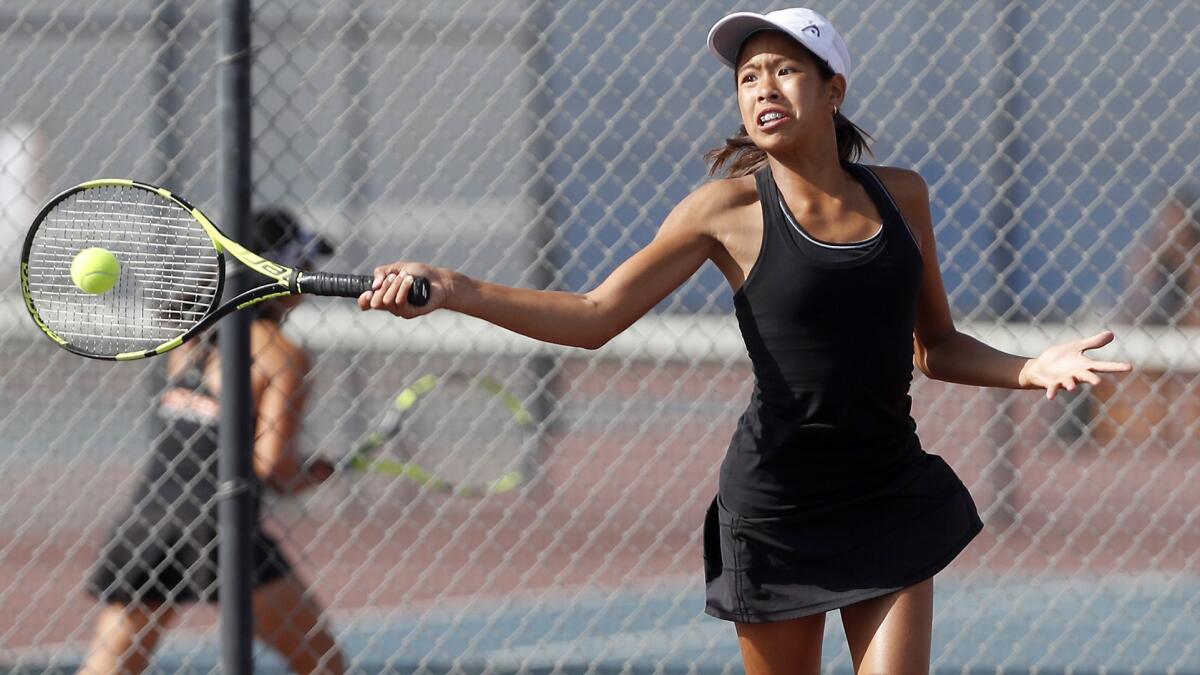 Huntington Beach High's Cindy Huynh, shown playing against Fountain Valley on Sept. 20, helped the Oilers beat Newport Harbor in a Sunset Conference crossover match on Thursday.