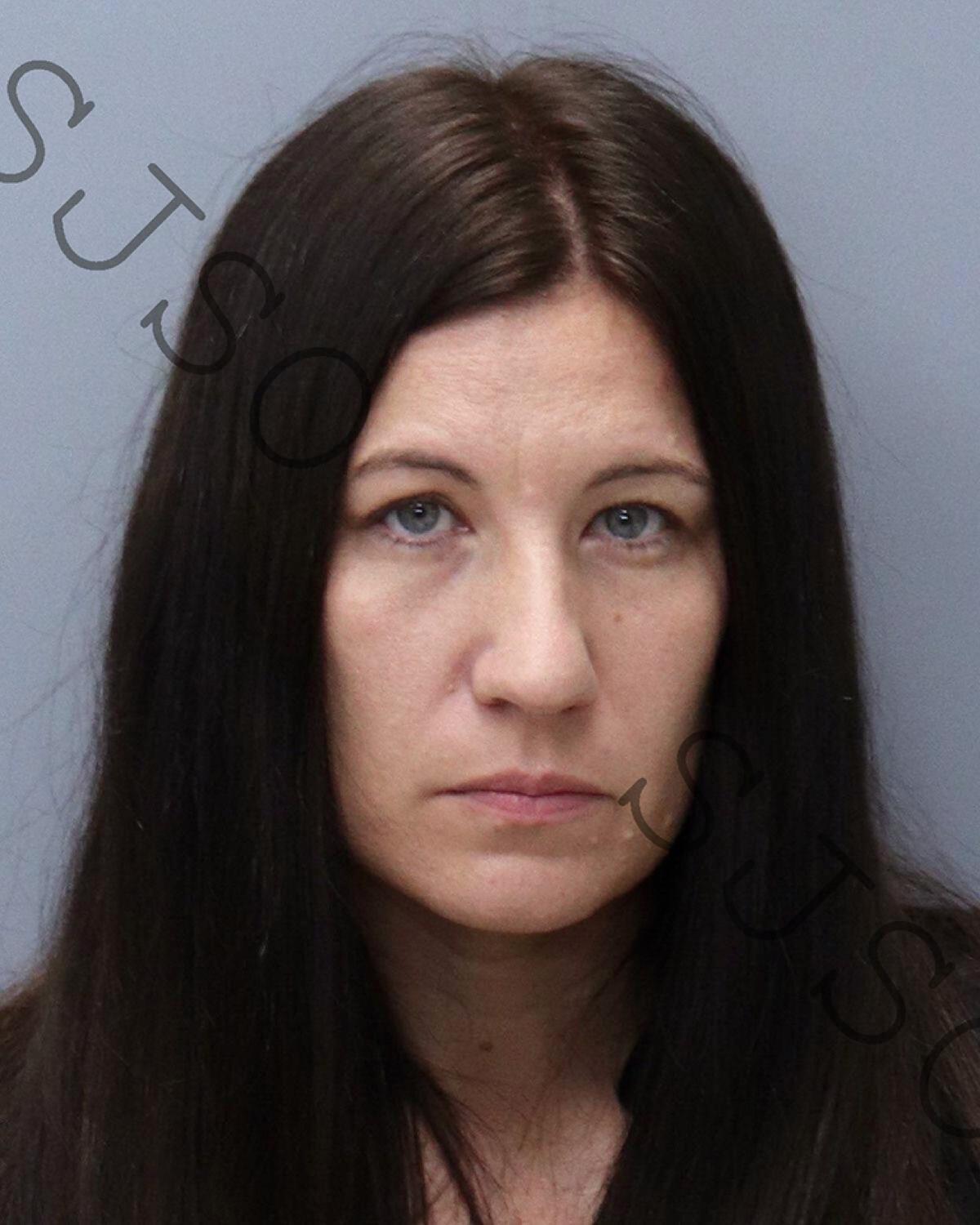 This photo provided by the St. Johns County Sheriff's Office shows Crystal Lane Smith. The mother of a 14-year-old Florida boy accused in a teenage girl's slaying is facing a charge of evidence tampering, authorities say. State Attorney R.J. Larizza said in a news release that Crystal Lane Smith, 35, was arrested Saturday morning, June 5, 2021, in St. John's County. She was later released on $25,000 bail. (St. Johns County Sheriff's Office via AP)