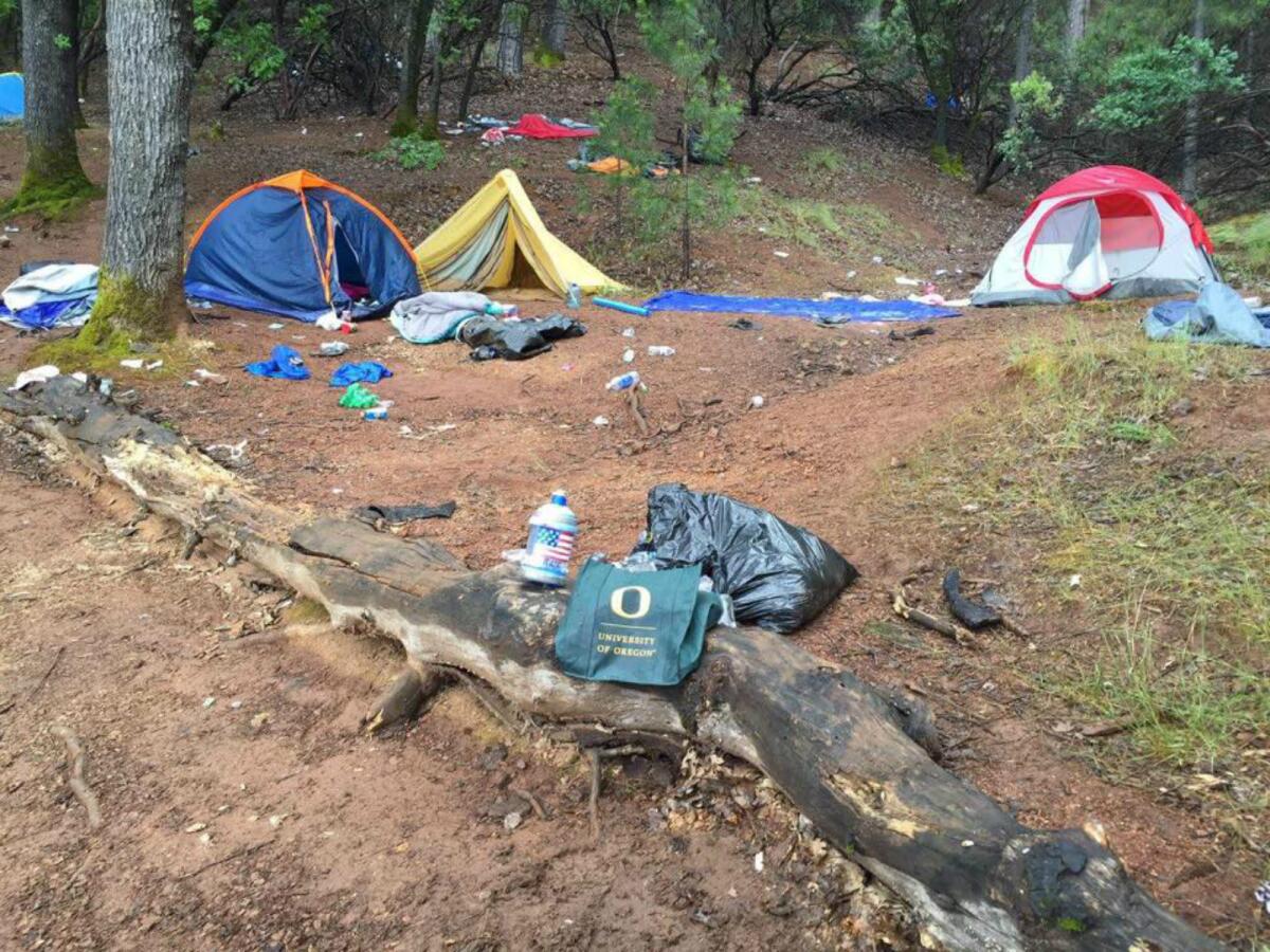 Tents and trash left behind at a Shasta Lake campsite in May 2016 are shown. (Jennifer Vick Cox / via Facebook)