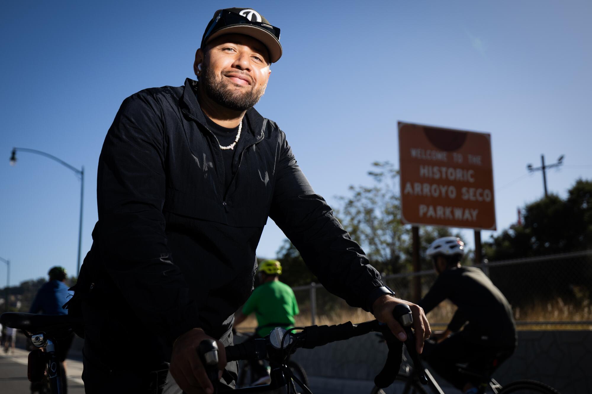 Jorge Avillas, of Los Angeles, takes a break in the middle of the 110 Freeway.