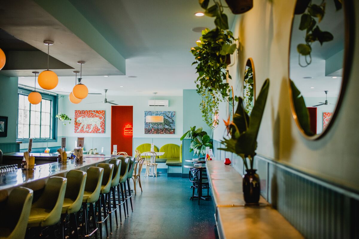 The Royale! Cocktails & Hamburgers dining room offers a blend of retro-diner comfort with a contemporary-lounge vibe.
