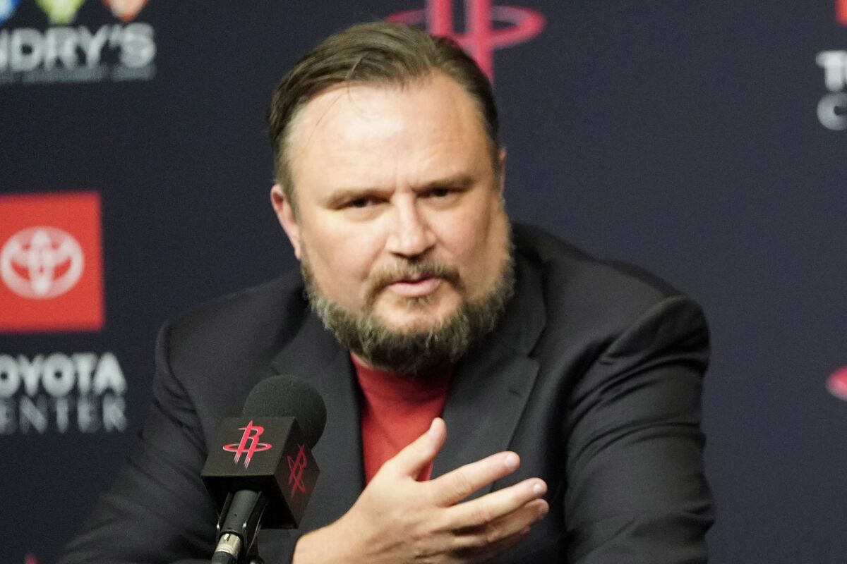 Houston Rockets general manager Daryl Morey, left, talks about recently acquired guard Russell Westbrook.