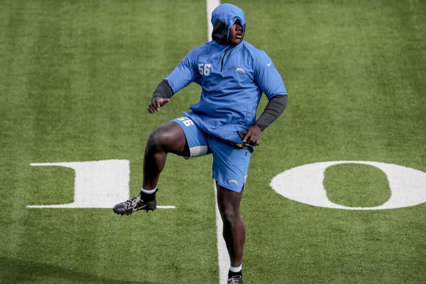Chargers linebacker Kenneth Murray  Jr. warms up before a game.