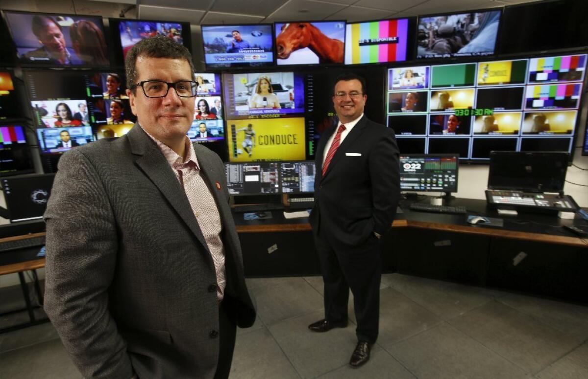 Otto Padron, left, President/COO of Meruelo Media Holdings LLC., and Xavier Gutierrez, President/Chief Investment Officer of Meruelo Group, are photographed inside the master control room at Meruelo Media Broadcast & Studio Center in Los Angeles.