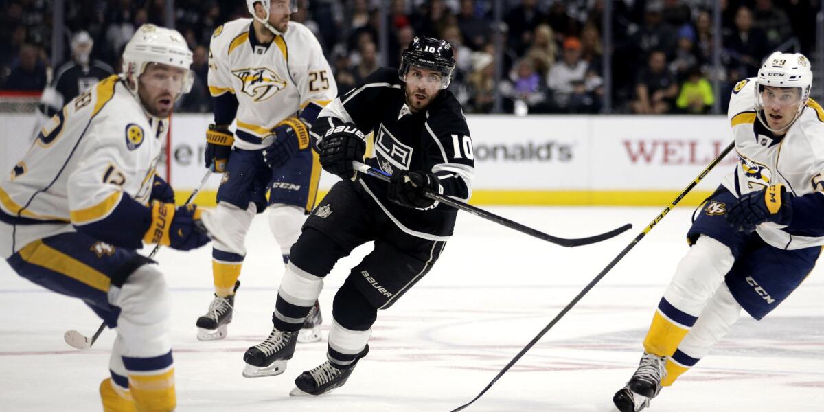 Kings center Mike Richards (10) sends the puck into the offensive zone against the Nashville Predators on Jan. 3.