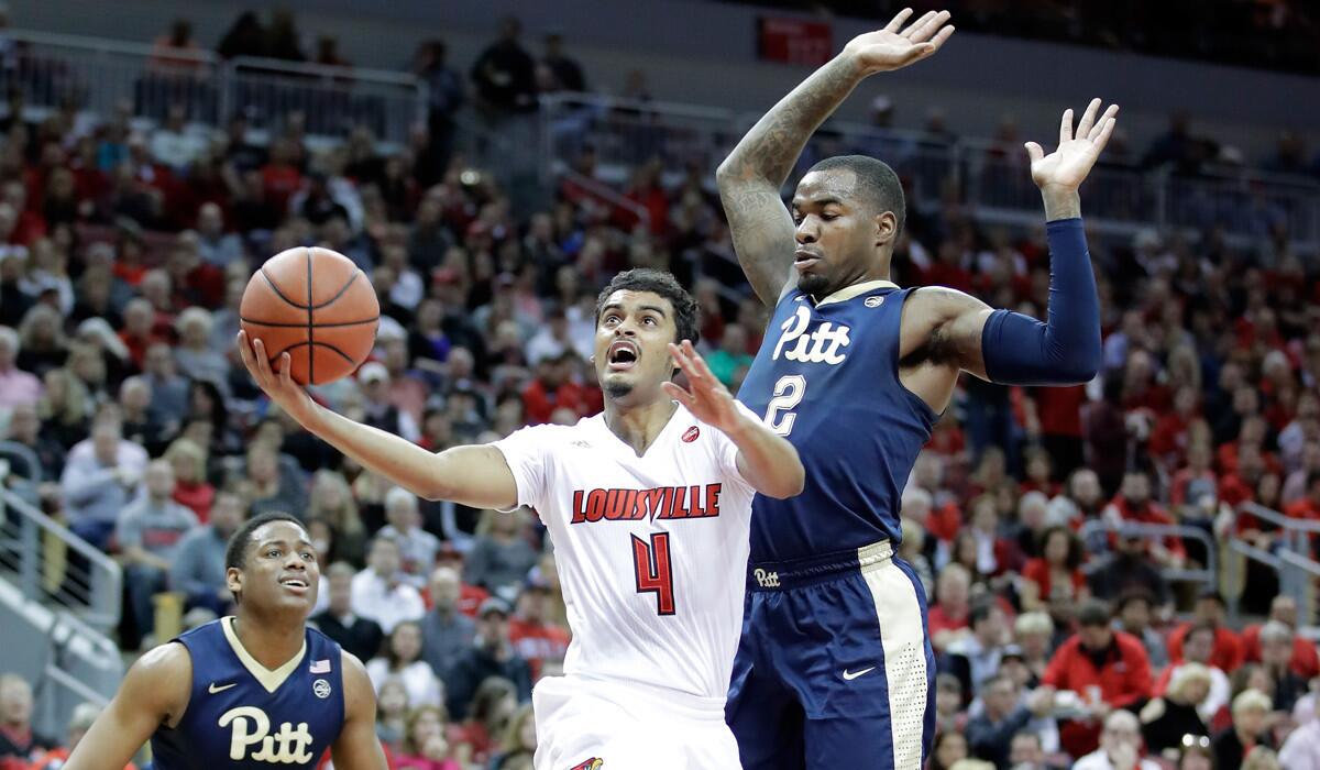 Louisville's Quentin Snider (4) shoots the ball during the game against Pittsburgh on Wednesday.