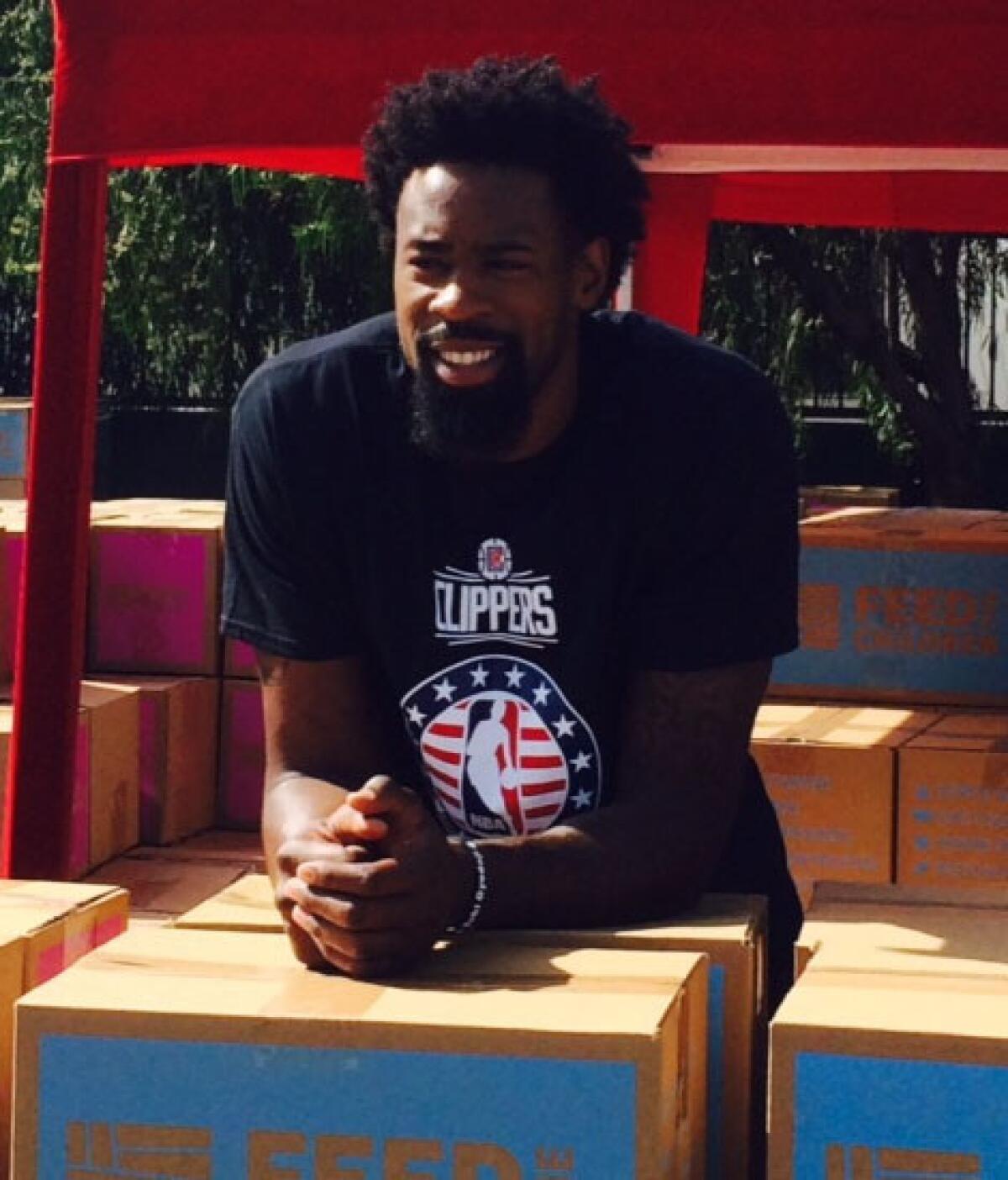 Clippers' DeAndre Jordan was among a group of players distributing food and personal-care items to 1,200 families at a Salvation Army in South Los Angeles on Saturday.
