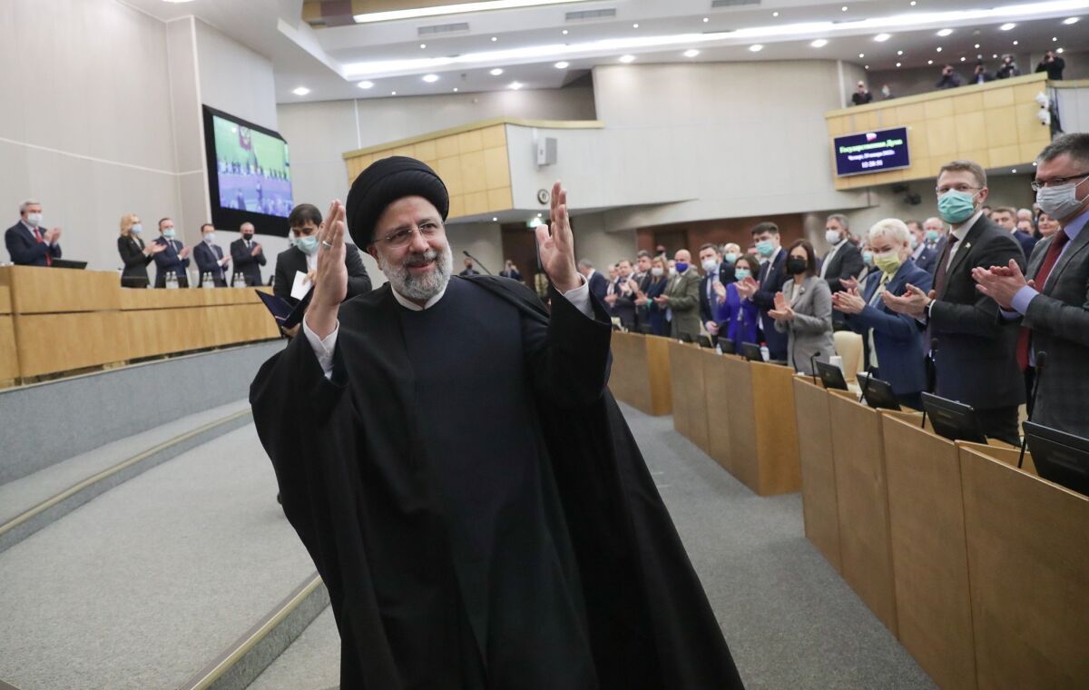 FILE - In this handout photo released by The State Duma, The Federal Assembly of The Russian Federation Press Service, Iranian President Ebrahim Raisi gestures after delivering his speech at the State Duma, the Lower House of the Russian Parliament in Moscow, Russia, Jan. 20, 2022. Russia’s war on Ukraine has exposed just how much Iran has tilted toward Moscow in recent years. Among ordinary Iranians, there is a great deal of sympathy for Ukraine. (The State Duma, The Federal Assembly of The Russian Federation Press Service via AP, File)