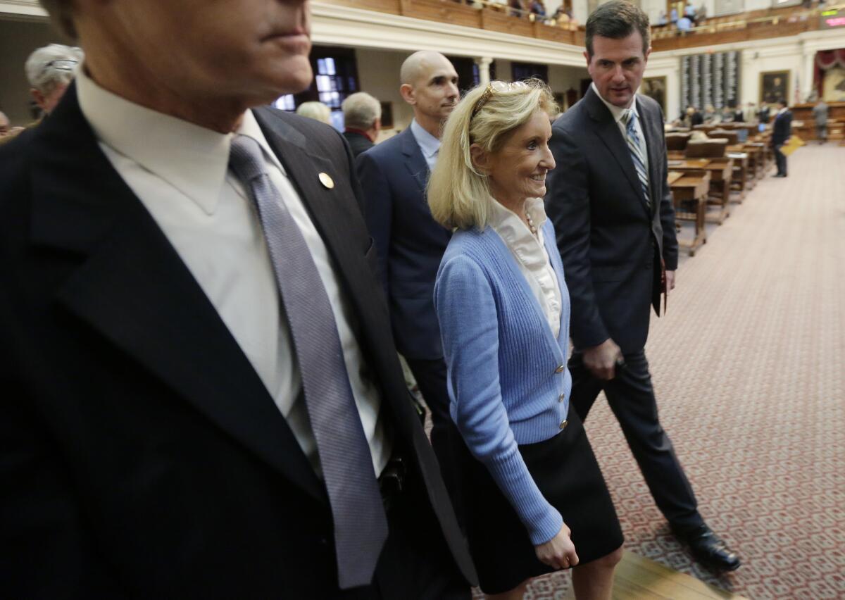 The Texas House gave final approval Wednesday to a restrictive abortion bill. Above, Republican Rep. Jodie Laubenberg, a sponsor of the measure, is shown leaving the House floor Tuesday night after the legislation won provisional approval.
