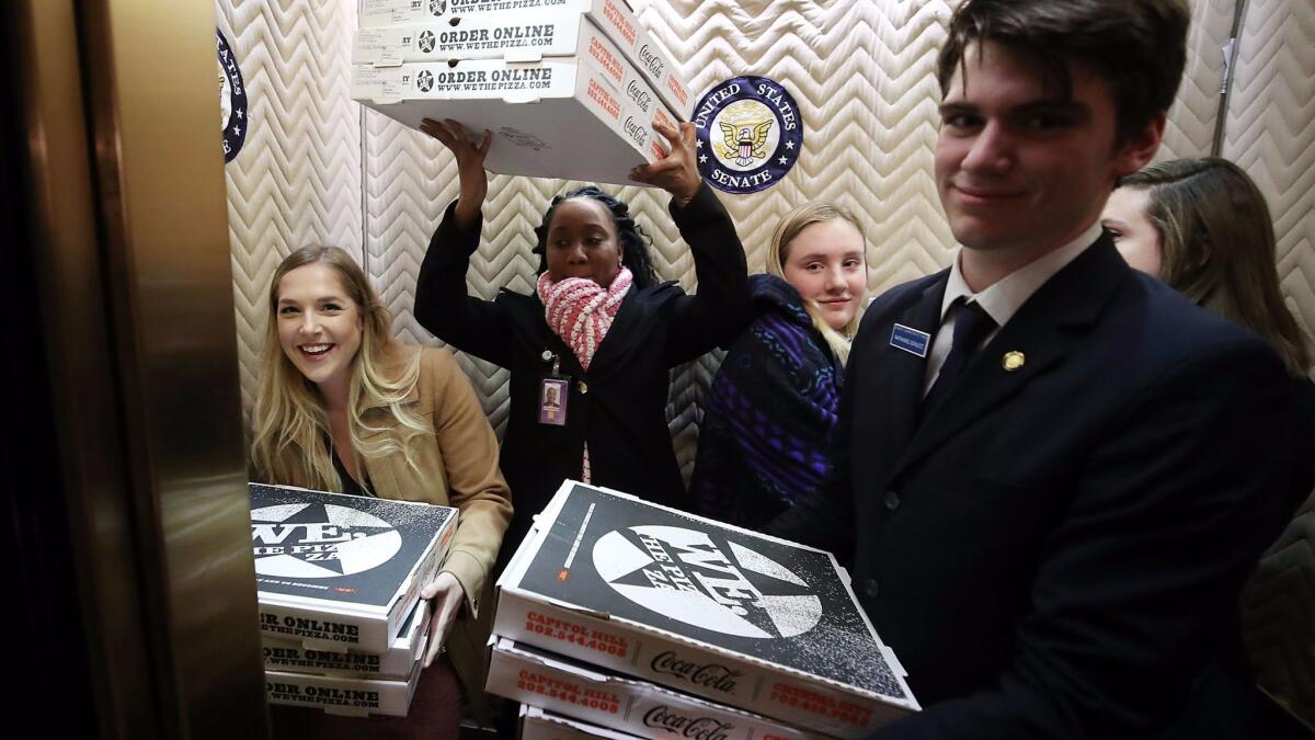 Staffers with Senate Minority Leader Charles E. Schumer's office brought in pizzas for a late evening of work Thursday on Capitol Hill.