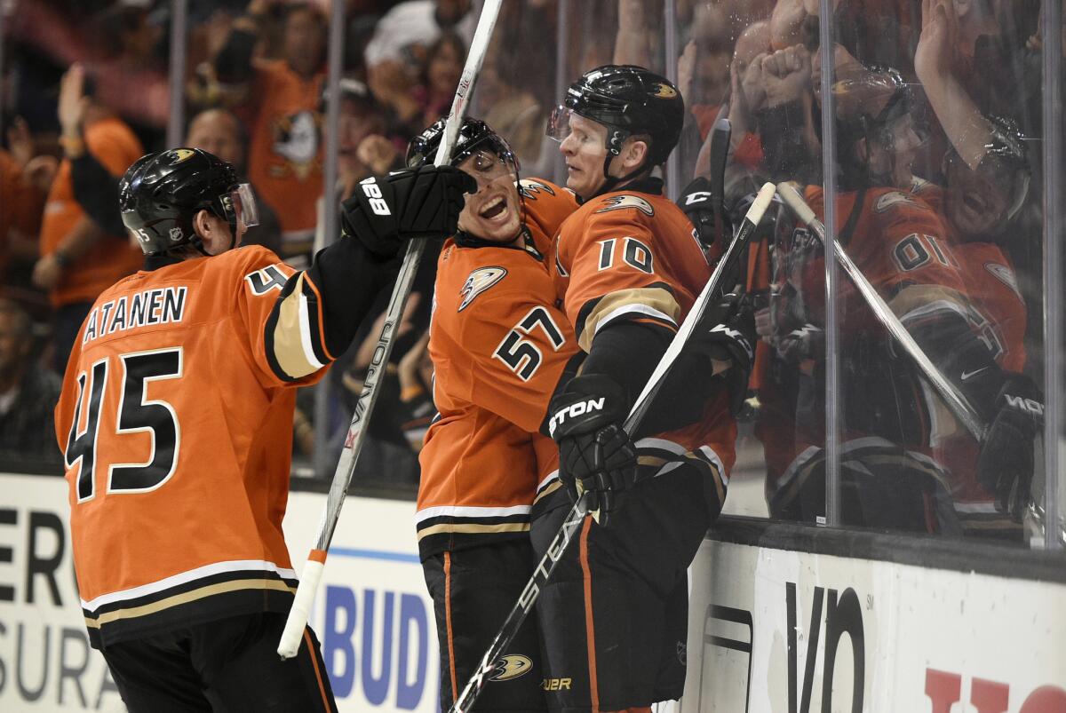 Ducks right wing Corey Perry (10) celebrates his goal with teammates David Perron (57) and Sami Vatanen (45) during the second period.