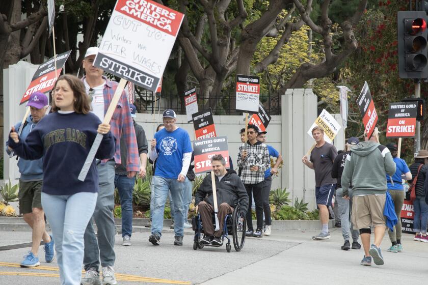 CULVER CITY, CA - MAY 09: Striking workers walk the picket line at Sony Studios in Culver City on Tuesday, May 9, 2023 during the Writers Guild of America strike. (Myung J. Chun / Los Angeles Times)