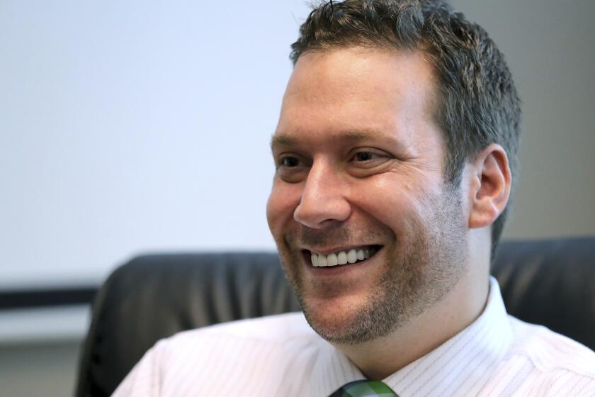 FILE - In this Sept. 30, 2019, file photo, Seminole County Tax Collector Joel Greenberg talks to the Orlando Sentinel during an interview at his office in Lake Mary, Fla. A former Florida tax collector whose arrest on sex trafficking and identity theft charges led to a probe of U.S. Rep. Matt Gaetz should not be granted a sentence that is less than federal guidelines in order to promote respect for the law and deter criminal behavior, federal prosecutors said in court papers. (Joe Burbank/Orlando Sentinel via AP, File)