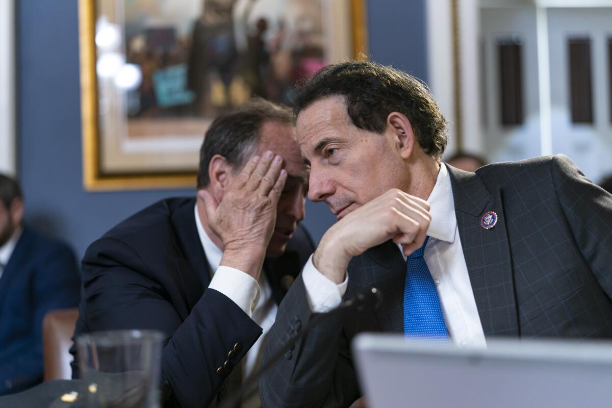 Rep. Jamie Raskin, right, joined at left by Rep. Ed Perlmutter