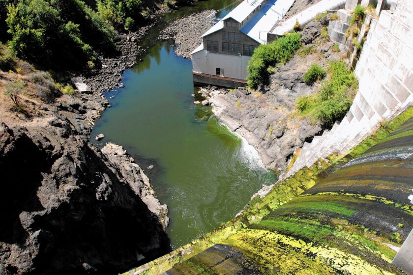 Water trickles over a dam on the Klamath River outside Hornbrook, Calif. The demise of a deal to end decades of feuding on the river could rekindle old battles over water use and dams in this remote corner of the state.