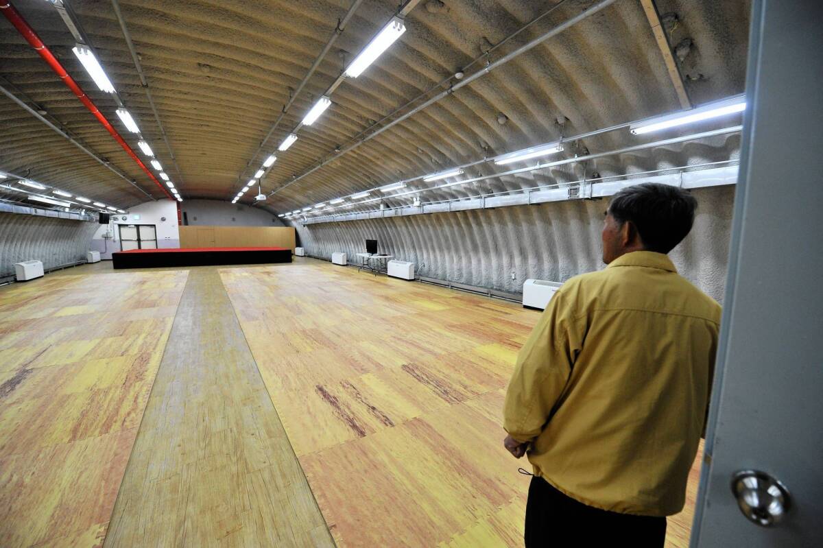 A South Korean man shows an air raid shelter on the island of Yeonpyeong, which North Korea shelled in 2010.