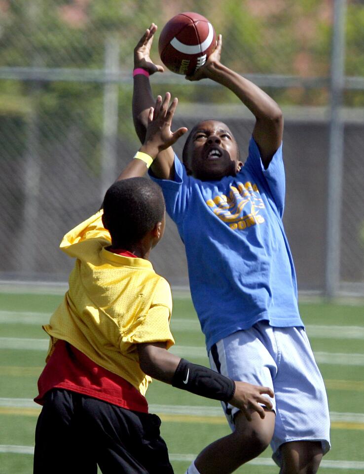 Photo Gallery: University of Michigan football players help local kids