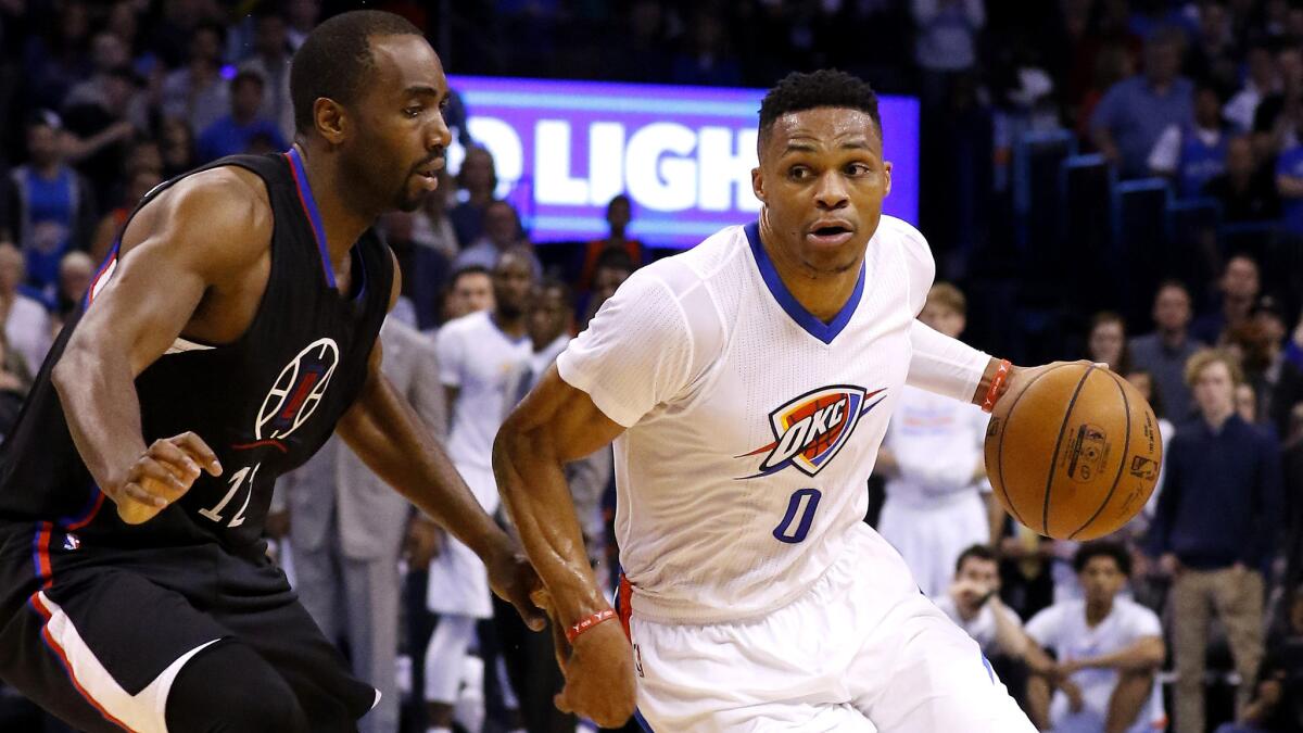Thunder guard Russell Westbrook tries to drive to the basket against Clippers forward Luc Mbah a Moute during the fourth quarter Thursday night.