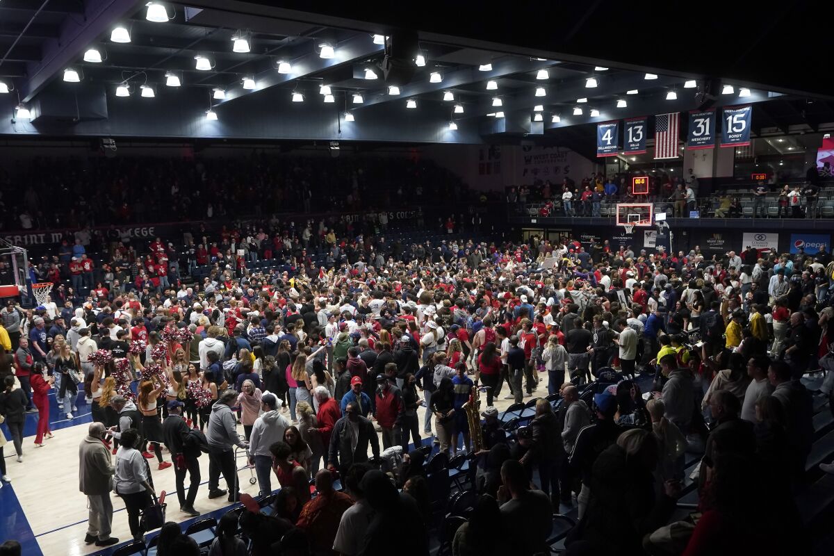 Fans pour onto the court after St. Mary's defeated Gonzaga on Feb. 26, 2022. 