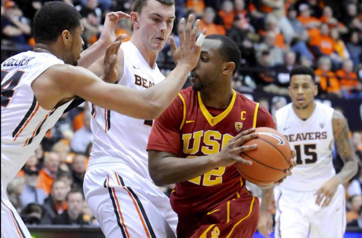 USC guard Bryon Wesley drives down the lane against Oregon State forward Devon Collier (44) and center Angus Brandt during a game last month in Corvallis.