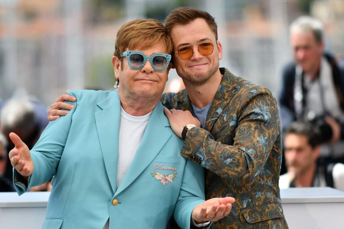 British singer-songwriter Elton John, left, and British actor Taron Egerton