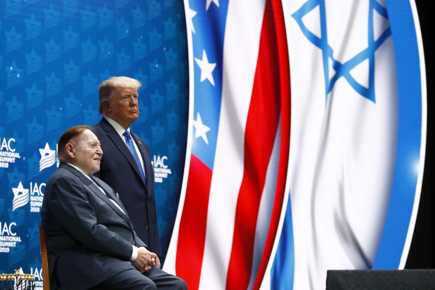 President Trump stands alongside mega donor Sheldon Adelson