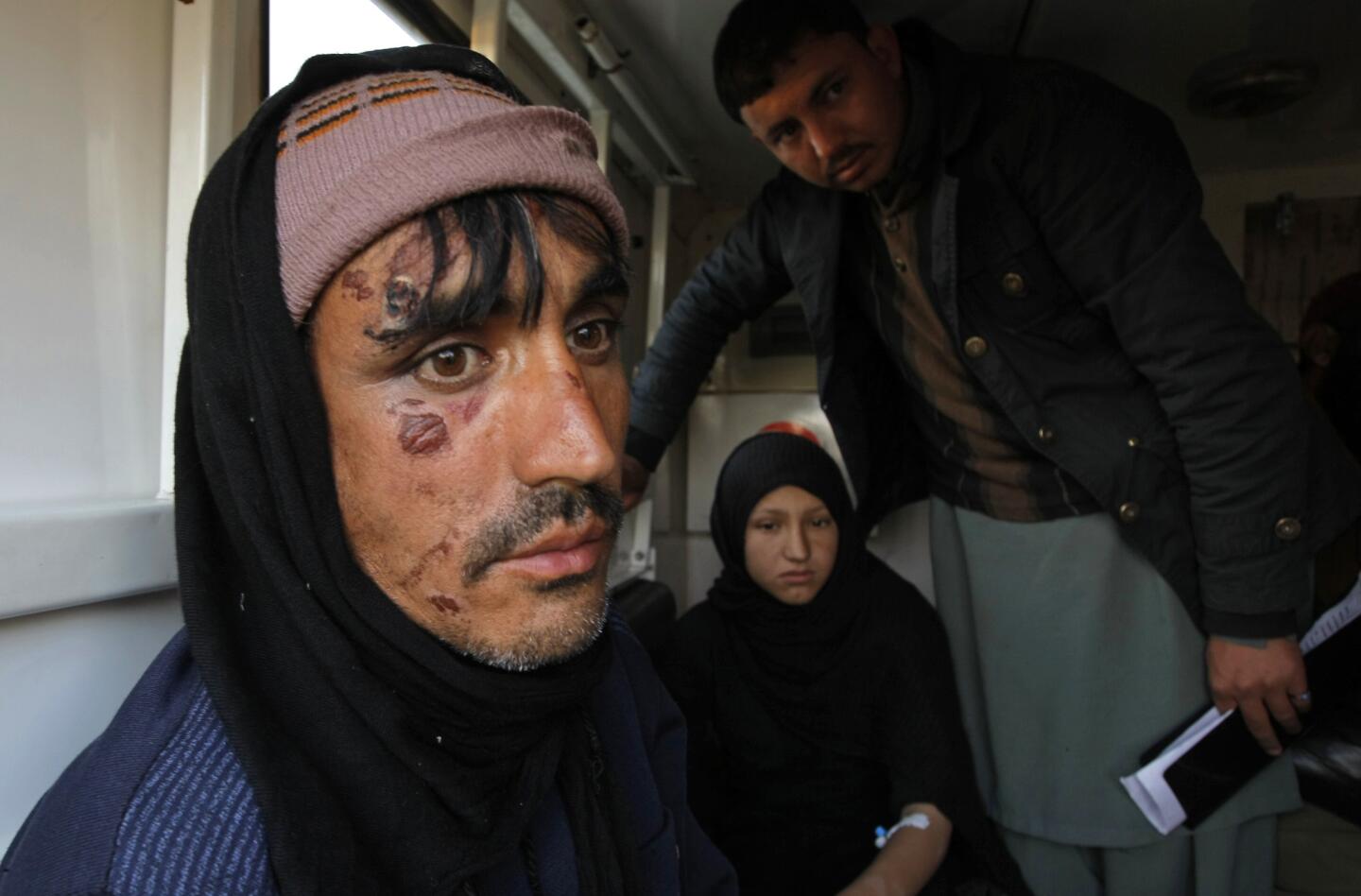 People who were injured in Monday's deadly earthquake arrive at Peshawar airbase in Pakistan, Tuesday, Oct. 27, 2015.