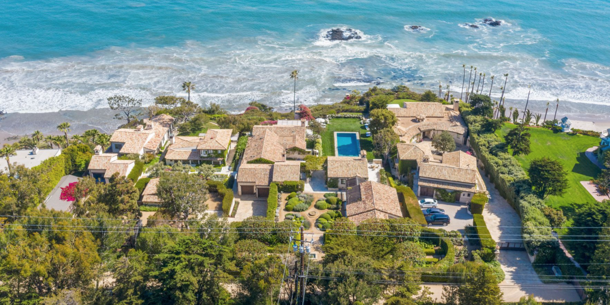 The five-acre spread include nine structures, as well as a cliff-side elevator that descends to the beach.