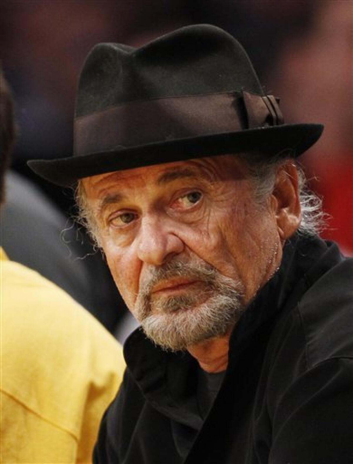 FILE - In this March 23, 2012 file photo, actor Joe Pesci sits court-side at the NBA basketball game between the Portland Trail Blazers and Los Angeles Lakers, in Los Angeles. An attorney for Pesci said Monday Feb. 4, 2013, that the Oscar-winning actor had settled a $3 million lawsuit against the makers of a planned biopic on the Gotti crime family for undisclosed terms. (AP Photo/Danny Moloshok, File)