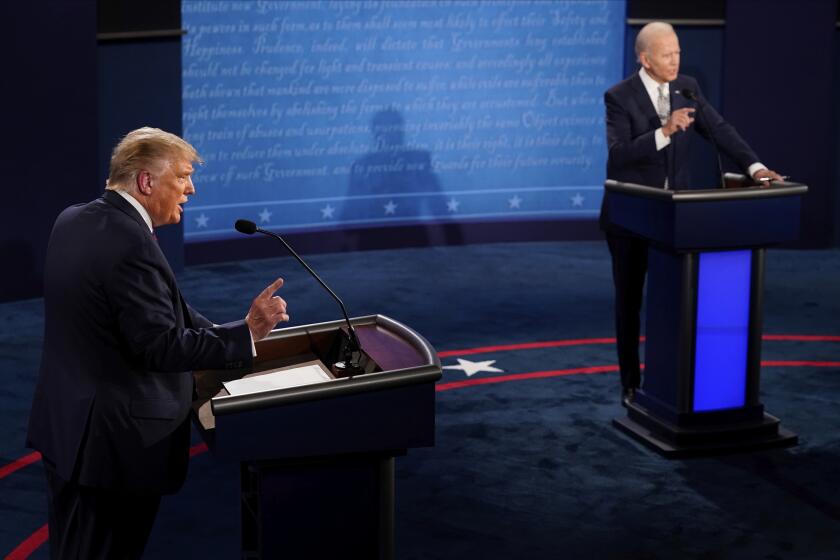 FILE - President Donald Trump and Democratic presidential candidate former Vice President Joe Biden exchange points during the first presidential debate Sept. 29, 2020, at Case Western University and Cleveland Clinic, in Cleveland, Ohio. President Joe Biden is trying to focus the campaign on former President Donald Trump's comments and policy proposals, sometimes more than his own. It's a time-worn strategy of White House incumbents to try to negatively define their rivals in the public's eyes. (AP Photo/Morry Gash, Pool, File)