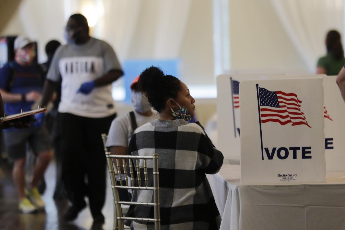 People in Atlanta wait to vote in Georgia's primary election in June.